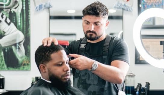 Precision clipper fade in progress at Colella Cutz