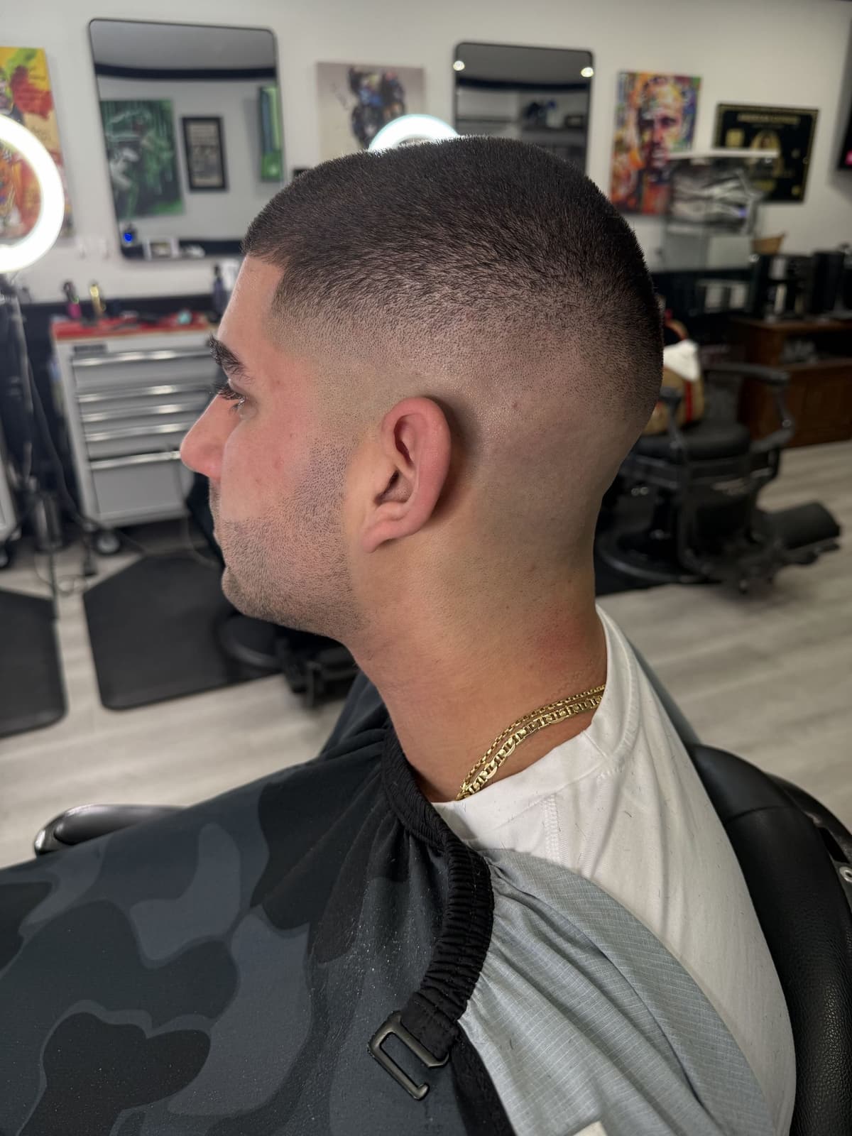 Sharp buzz fade side profile