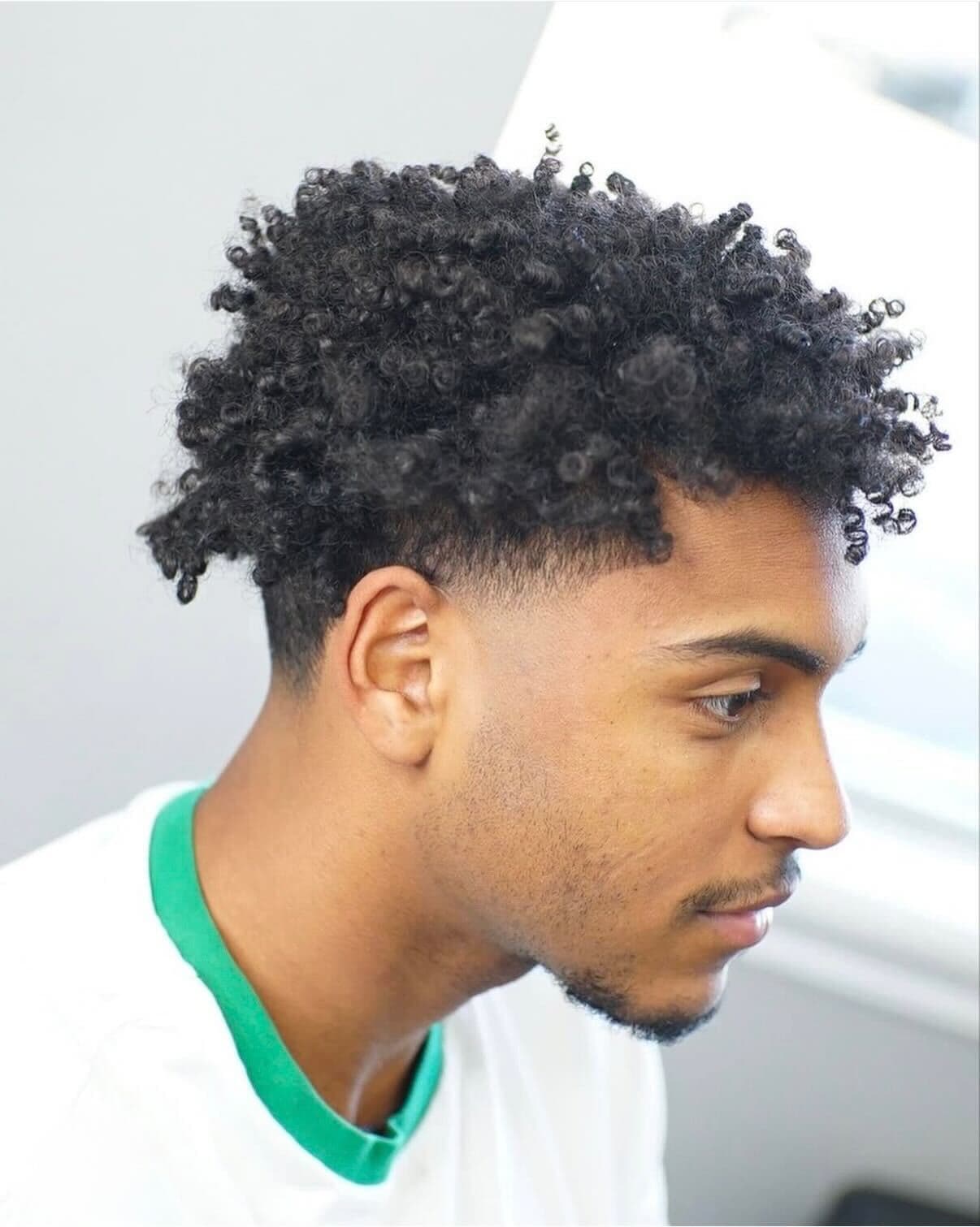 Curly top with temple fade at Colella Cutz Barber Studios