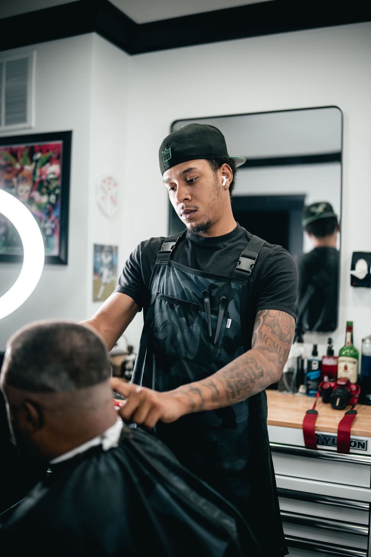 Barber finishing a taper fade