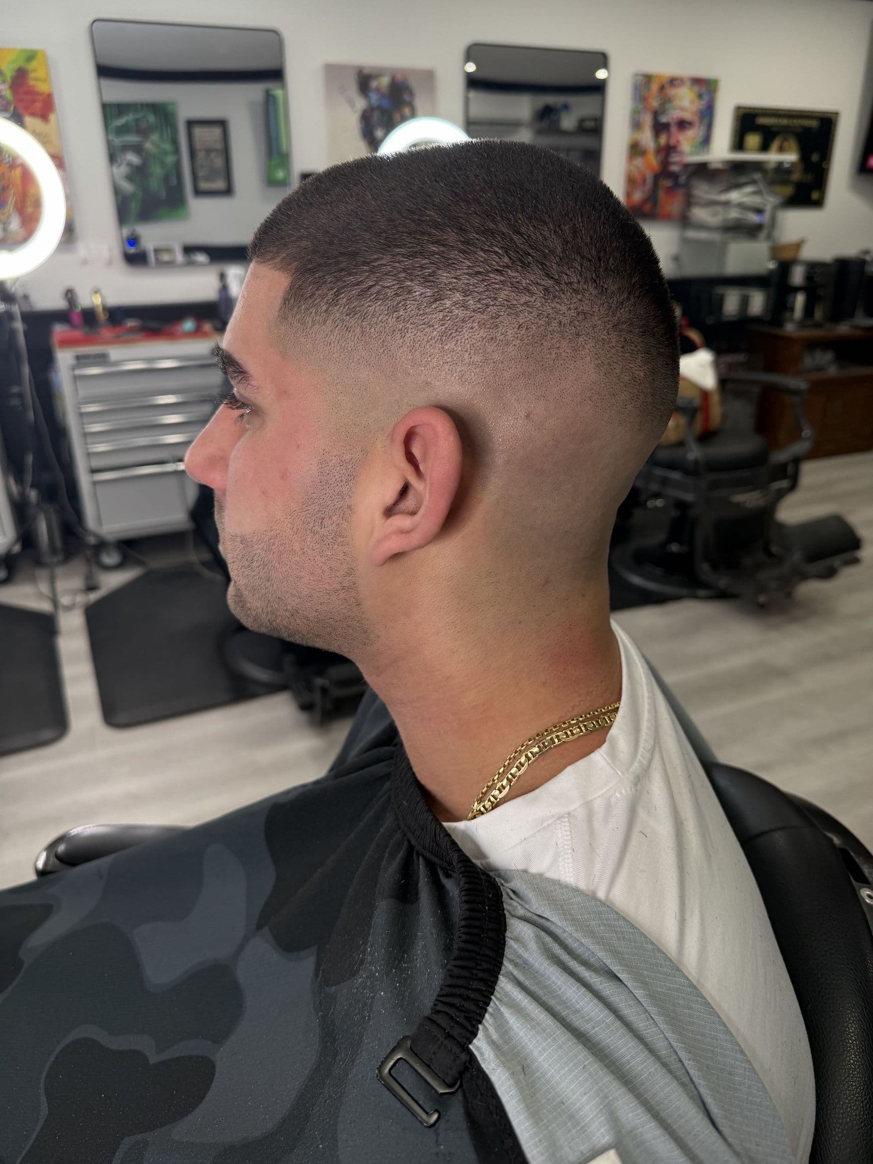 Sharp buzz fade side profile